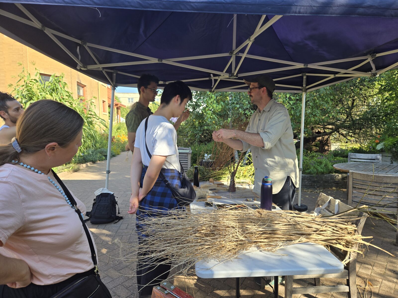 Artist demonstrating turning native plants into fiber
